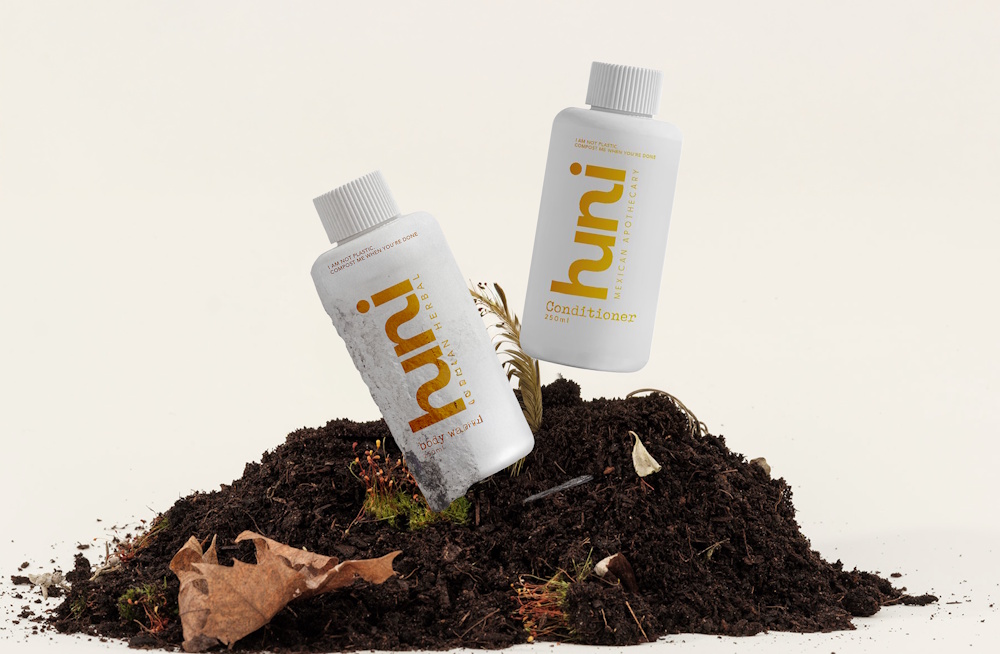 Huni compostable bottles in soil